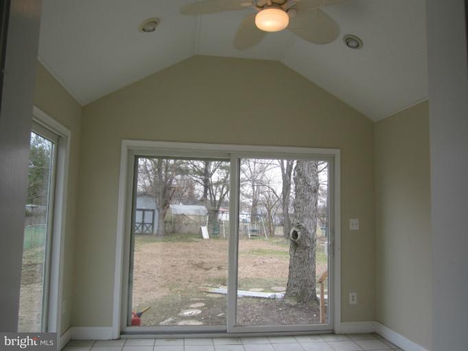2107 Rolling Rd. Windsor Mill, MD 21244 - Photo 16 of 29 a view of a room with a large window and front door
