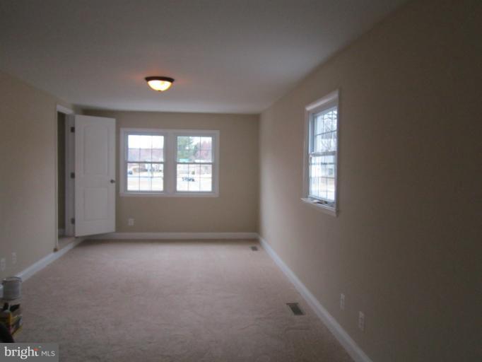 2107 Rolling Rd. Windsor Mill, MD 21244 - Photo 17 of 29 an empty room with windows