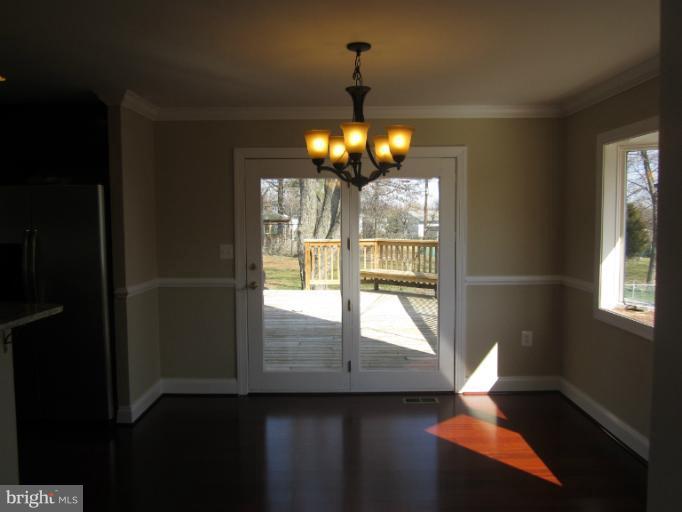 2107 Rolling Rd. Windsor Mill, MD 21244 - Photo 20 of 29 a view of a livingroom with furniture window and hardwood floor