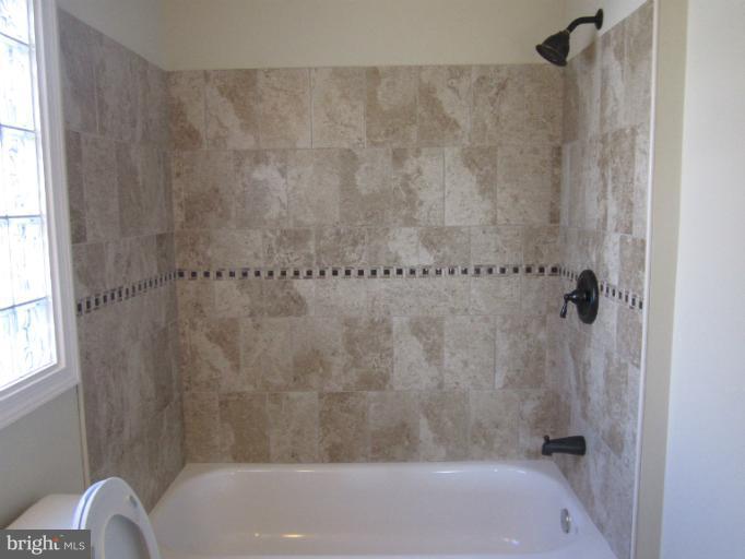 2107 Rolling Rd. Windsor Mill, MD 21244 - Photo 22 of 29 a bathroom with a shower