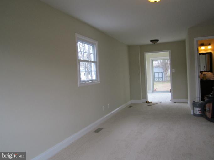 2107 Rolling Rd. Windsor Mill, MD 21244 - Photo 25 of 29 a view of a livingroom with a flat screen tv