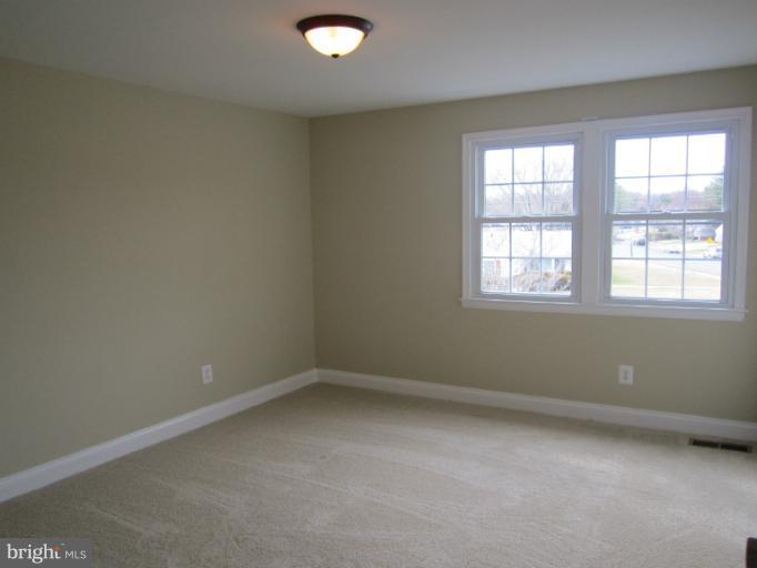 2107 Rolling Rd. Windsor Mill, MD 21244 - Photo 26 of 29 an empty room with a window