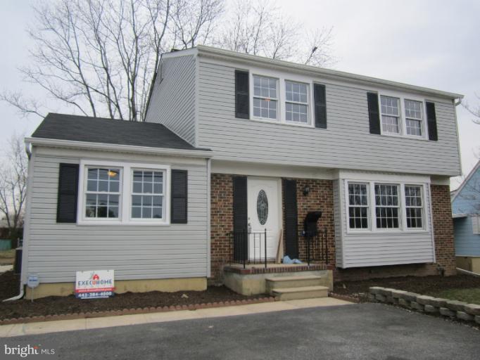 2107 Rolling Rd. Windsor Mill, MD 21244 - Photo 29 of 29 a view of a house with a yard