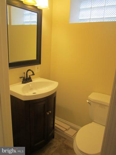 2107 Rolling Rd. Windsor Mill, MD 21244 - Photo 6 of 29 a bathroom with a sink and a toilet