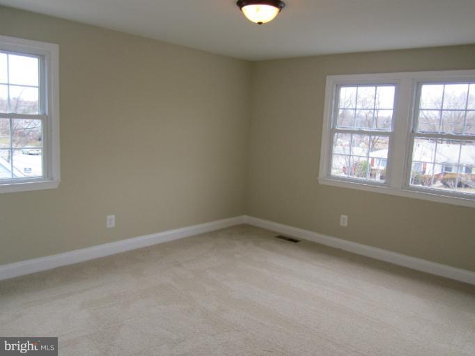 2107 Rolling Rd. Windsor Mill, MD 21244 - Photo 9 of 29 an empty room with a window