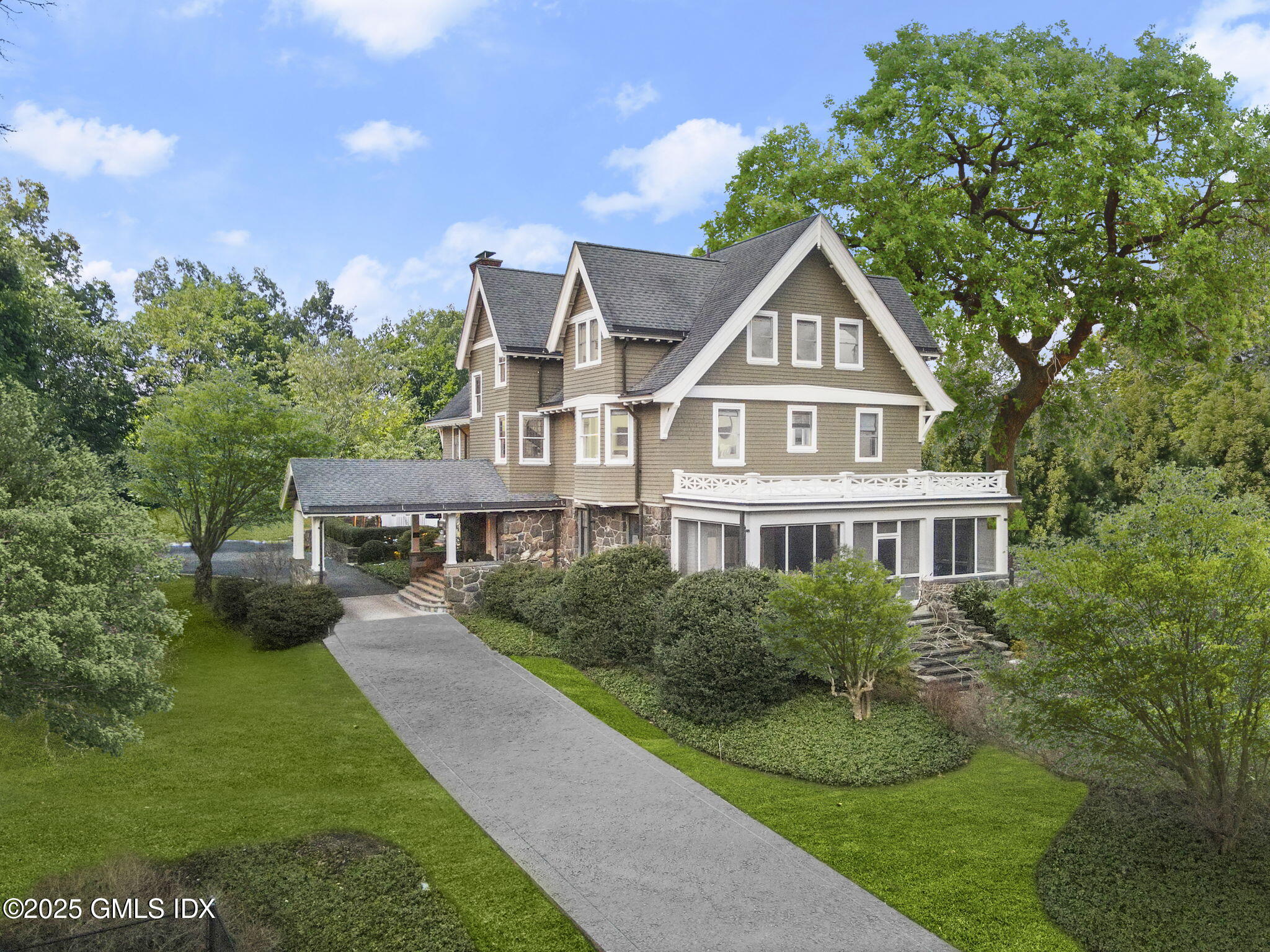 151 Old Church Road Greenwich, CT 06830 - Photo 1 of 1 a front view of a house with a yard