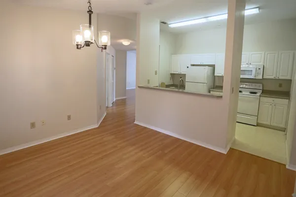 a view of a kitchen from the hallway