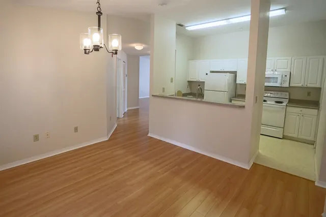 a view of a kitchen from the hallway