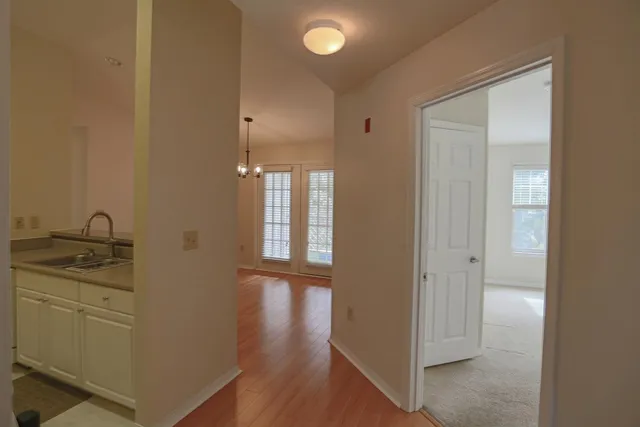 a bathroom with a granite countertop sink a mirror and a shower