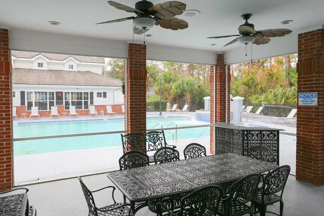 a view of a dining room with furniture window and outside view