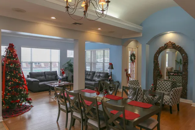 a living room with furniture and a christmas tree