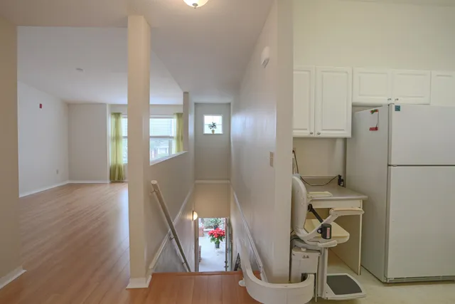 a view of an entryway with wooden floor