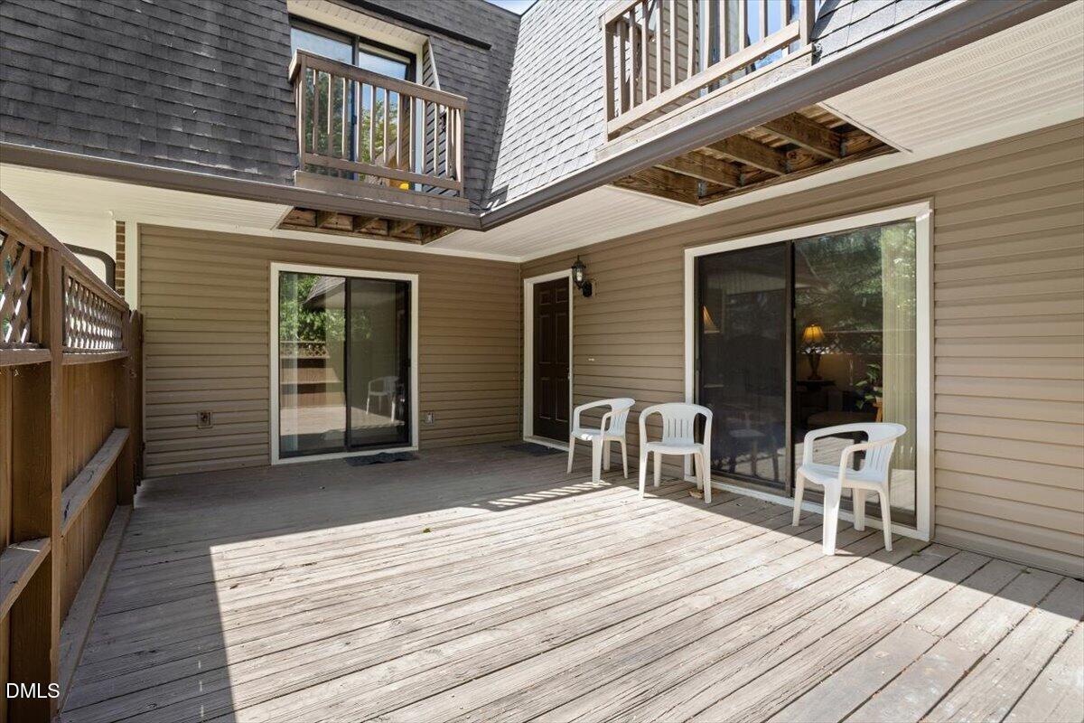 163 Springberry Lane Chapel Hill, NC 27517 - Photo 2 of 32 a balcony with furniture and a window