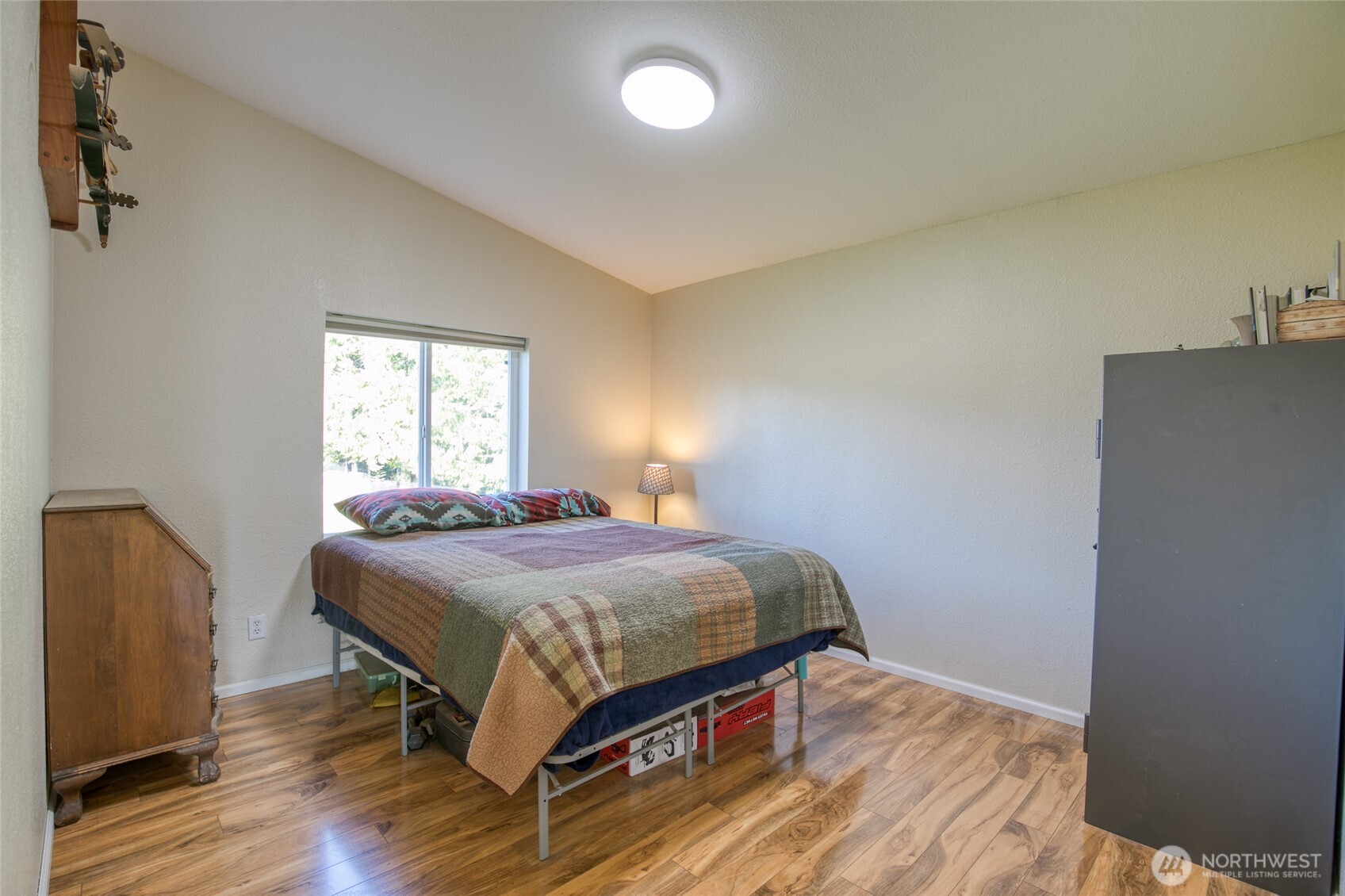 4687 Wishkah Road Aberdeen, WA 98520 - Photo 15 of 29 a bedroom with a bed and window