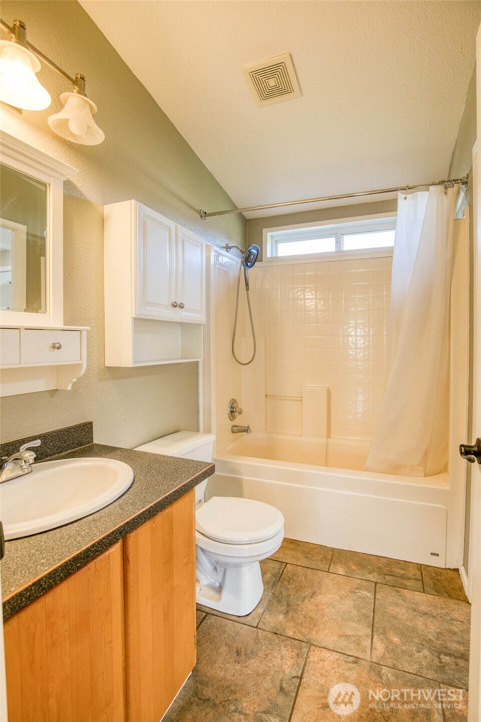 4687 Wishkah Road Aberdeen, WA 98520 - Photo 17 of 29 a bathroom with a granite countertop sink toilet and shower