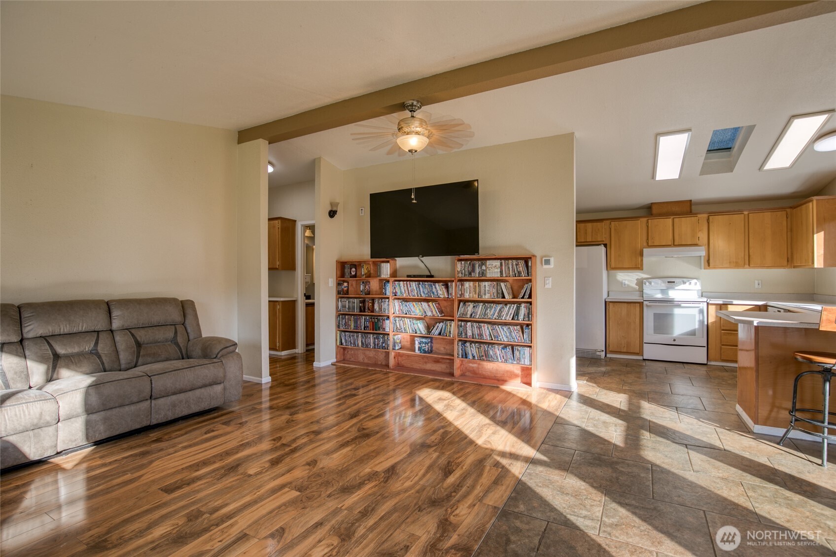 4687 Wishkah Road Aberdeen, WA 98520 - Photo 2 of 29 a living room with furniture and a flat screen tv
