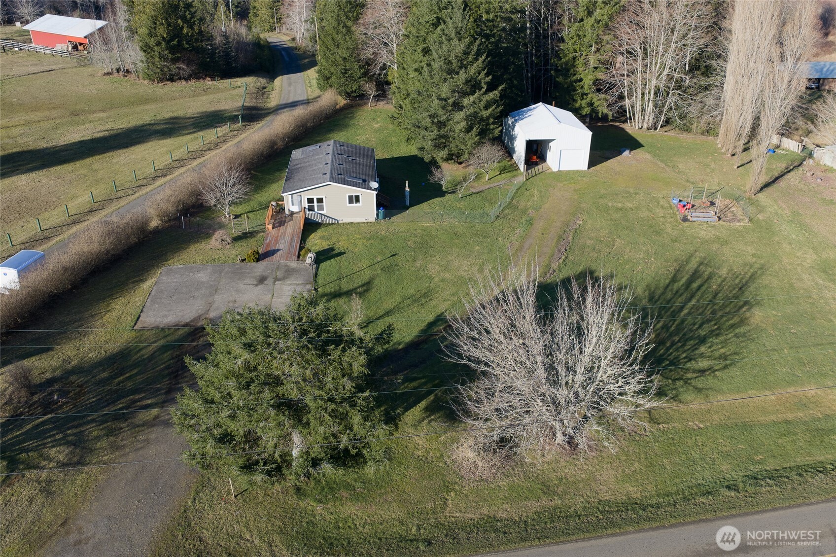 4687 Wishkah Road Aberdeen, WA 98520 - Photo 29 of 29 a aerial view of a house with a yard