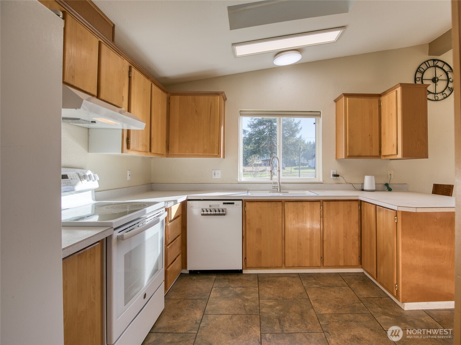 4687 Wishkah Road Aberdeen, WA 98520 - Photo 9 of 29 a kitchen with stainless steel appliances granite countertop a sink and a stove