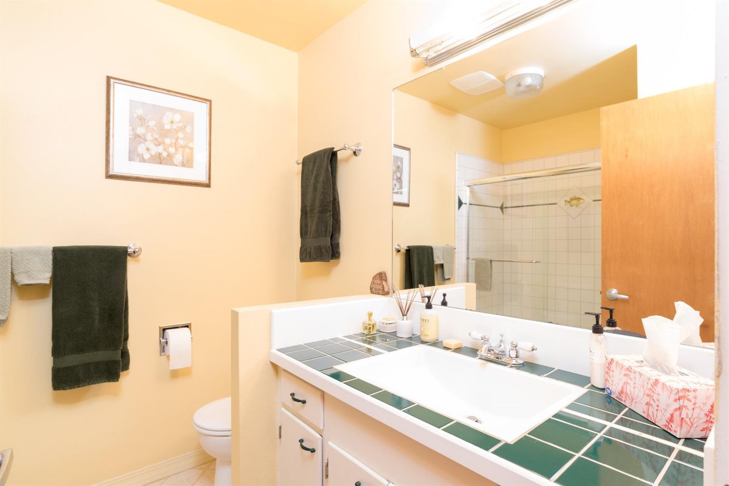 206 West Hilltop Road Talent, OR 97540 - Photo 23 of 29 a bathroom with a granite countertop sink and a mirror