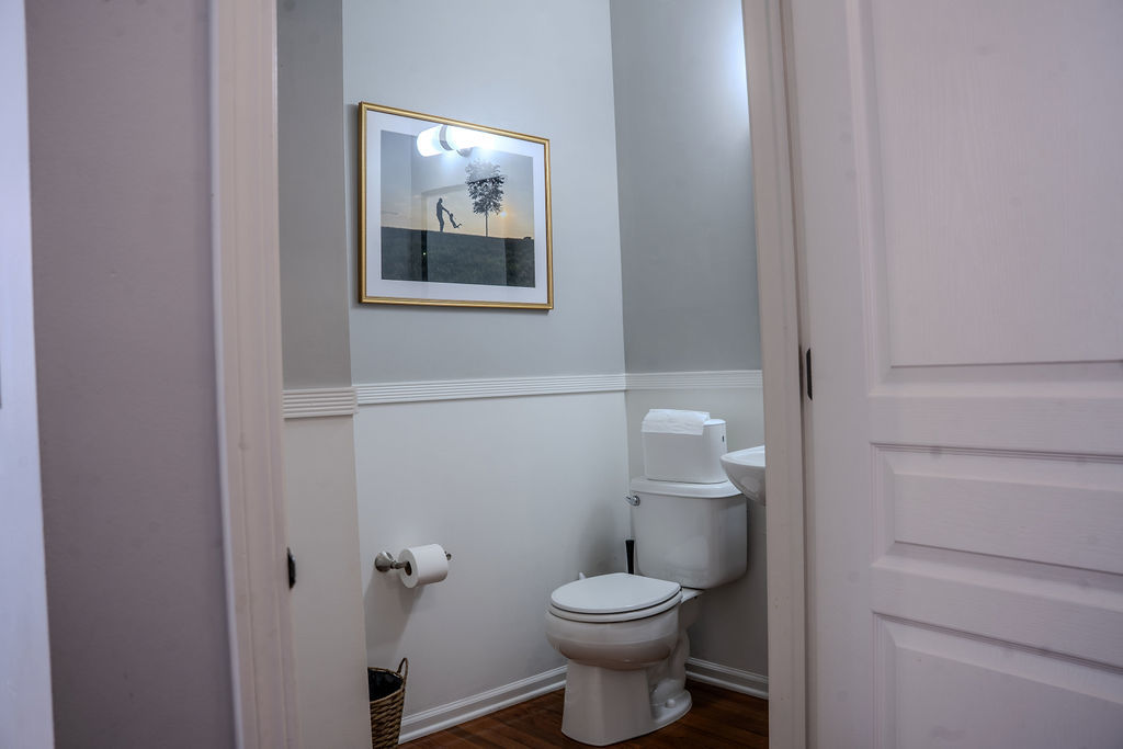 250 Tiger Street Bolingbrook, IL 60490 - Photo 12 of 36 a white toilet sitting next to a bathroom sink