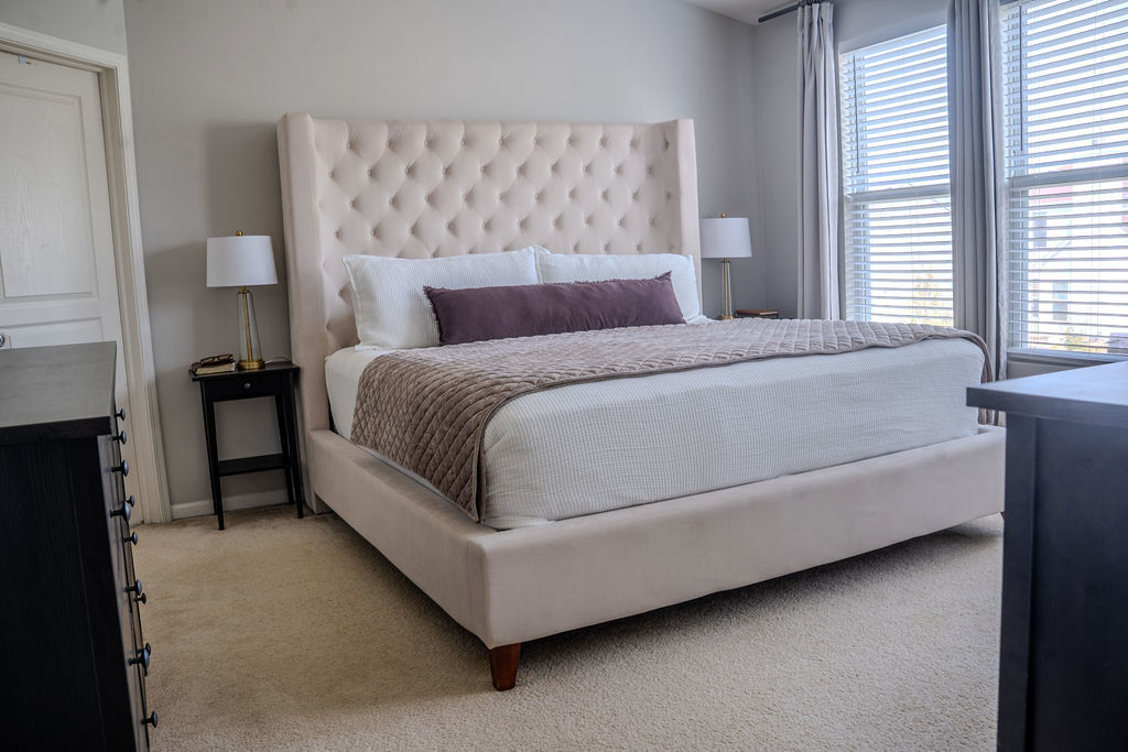 250 Tiger Street Bolingbrook, IL 60490 - Photo 19 of 36 a bed sitting in a bedroom next to a window with lamp