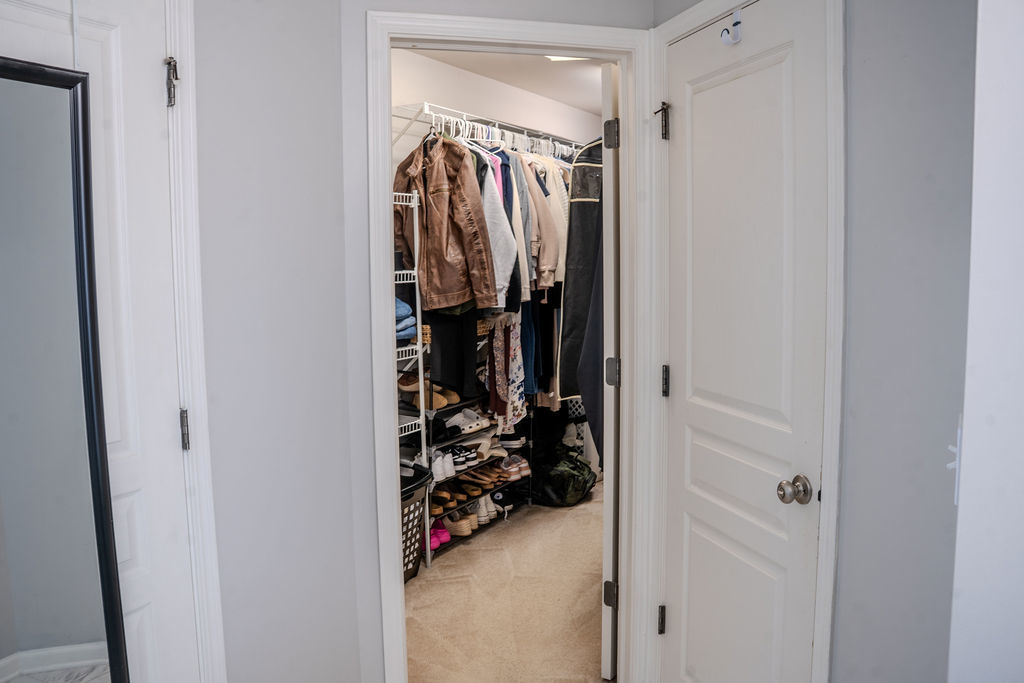250 Tiger Street Bolingbrook, IL 60490 - Photo 23 of 36 a view of walk in closet with clothes