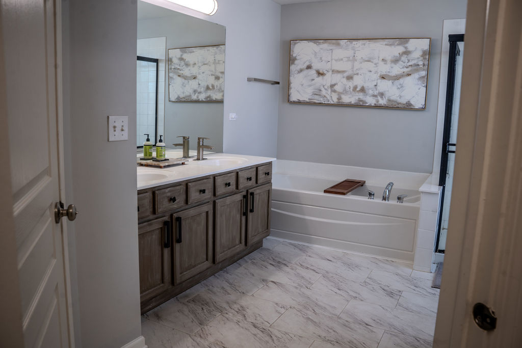250 Tiger Street Bolingbrook, IL 60490 - Photo 24 of 36 a spacious bathroom with a bathtub and a shower
