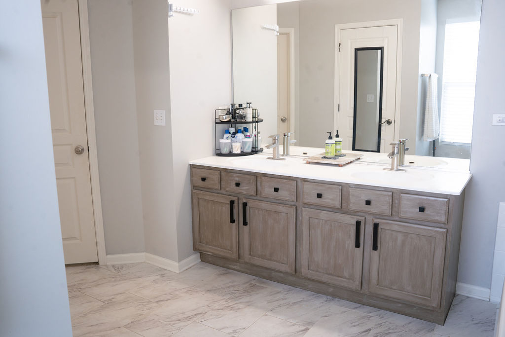 250 Tiger Street Bolingbrook, IL 60490 - Photo 26 of 36 a bathroom with a double vanity sink and a mirror