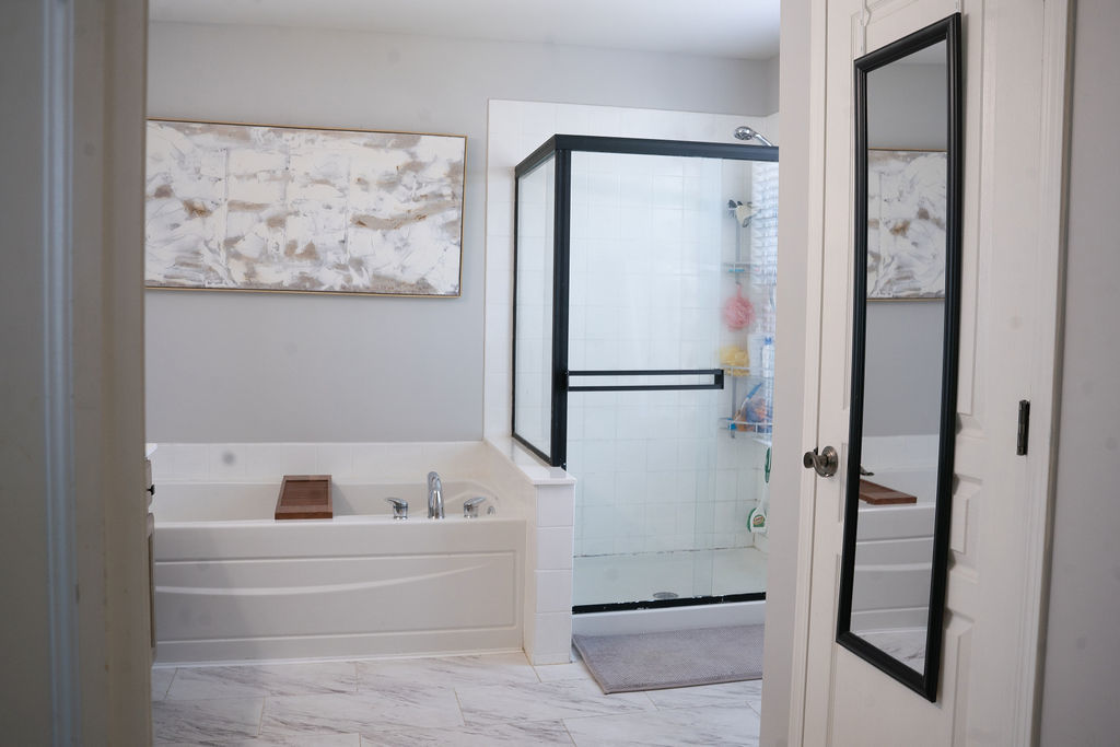 250 Tiger Street Bolingbrook, IL 60490 - Photo 27 of 36 a bathroom with a bathtub and shower