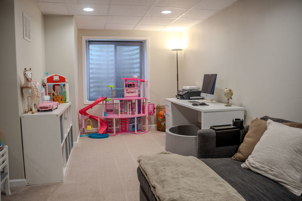 250 Tiger Street Bolingbrook, IL 60490 - Photo 32 of 36 a room with furniture and a flat screen tv