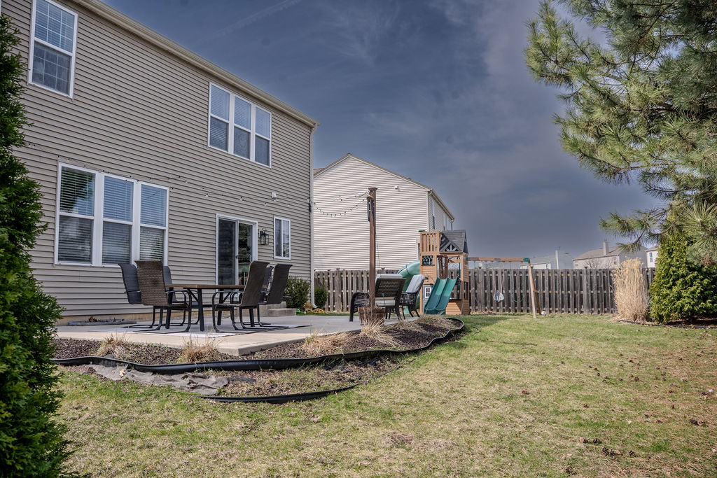 250 Tiger Street Bolingbrook, IL 60490 - Photo 33 of 36 a view of a house with backyard and sitting area