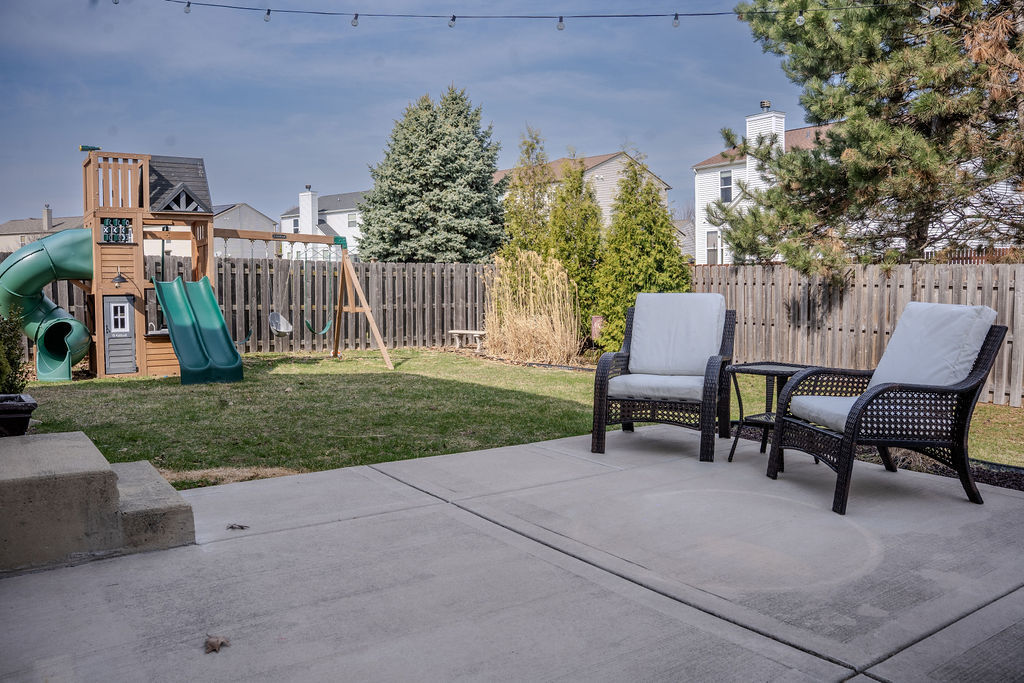 250 Tiger Street Bolingbrook, IL 60490 - Photo 35 of 36 a view of a bench in the garden