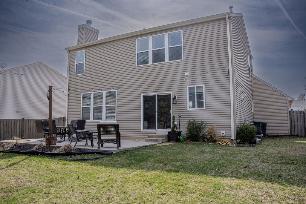 250 Tiger Street Bolingbrook, IL 60490 - Photo 36 of 36 a house view with a seating space and garden