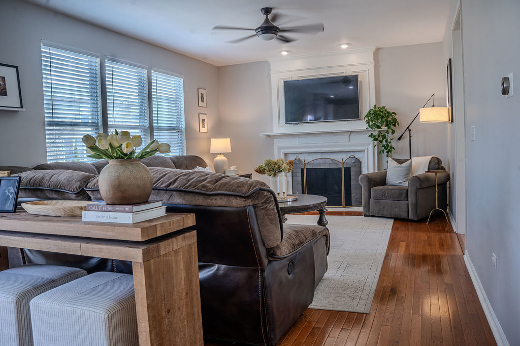 250 Tiger Street Bolingbrook, IL 60490 - Photo 7 of 36 a living room with furniture a fireplace and a potted plant