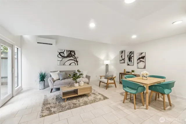 a living room with furniture and a rug