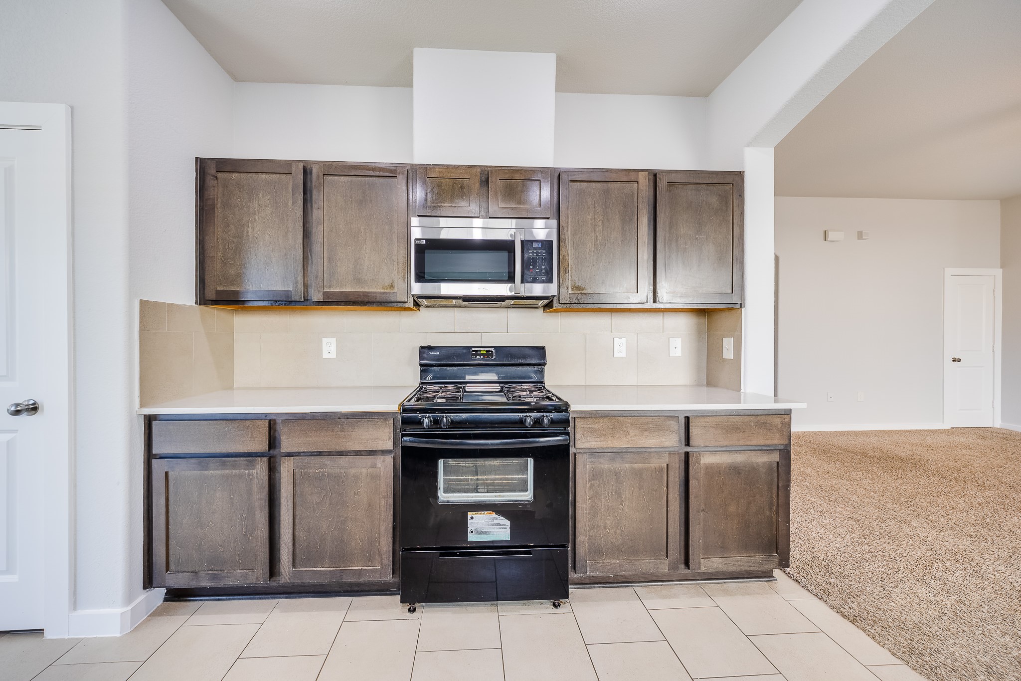 6807 Alamitos Court Rosharon, TX 77583 - Photo 13 of 34 Fully equipped kitchen including modern appliances, ample storage, and a functional layout perfect for cooking and entertaining.