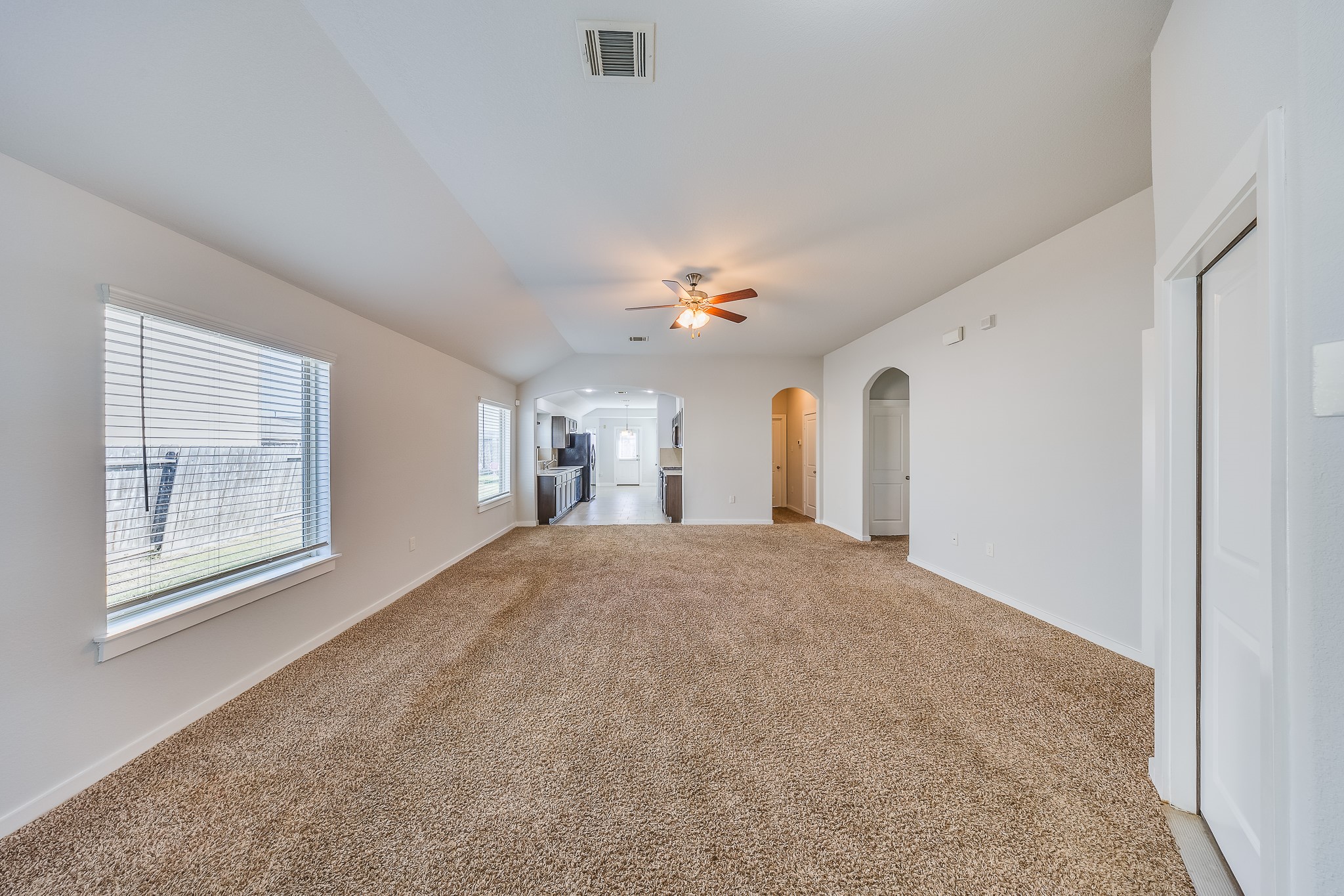 6807 Alamitos Court Rosharon, TX 77583 - Photo 2 of 34 Bright, open living room with abundant natural light, spacious layout, and inviting atmosphere perfect for relaxing or entertaining guests.
