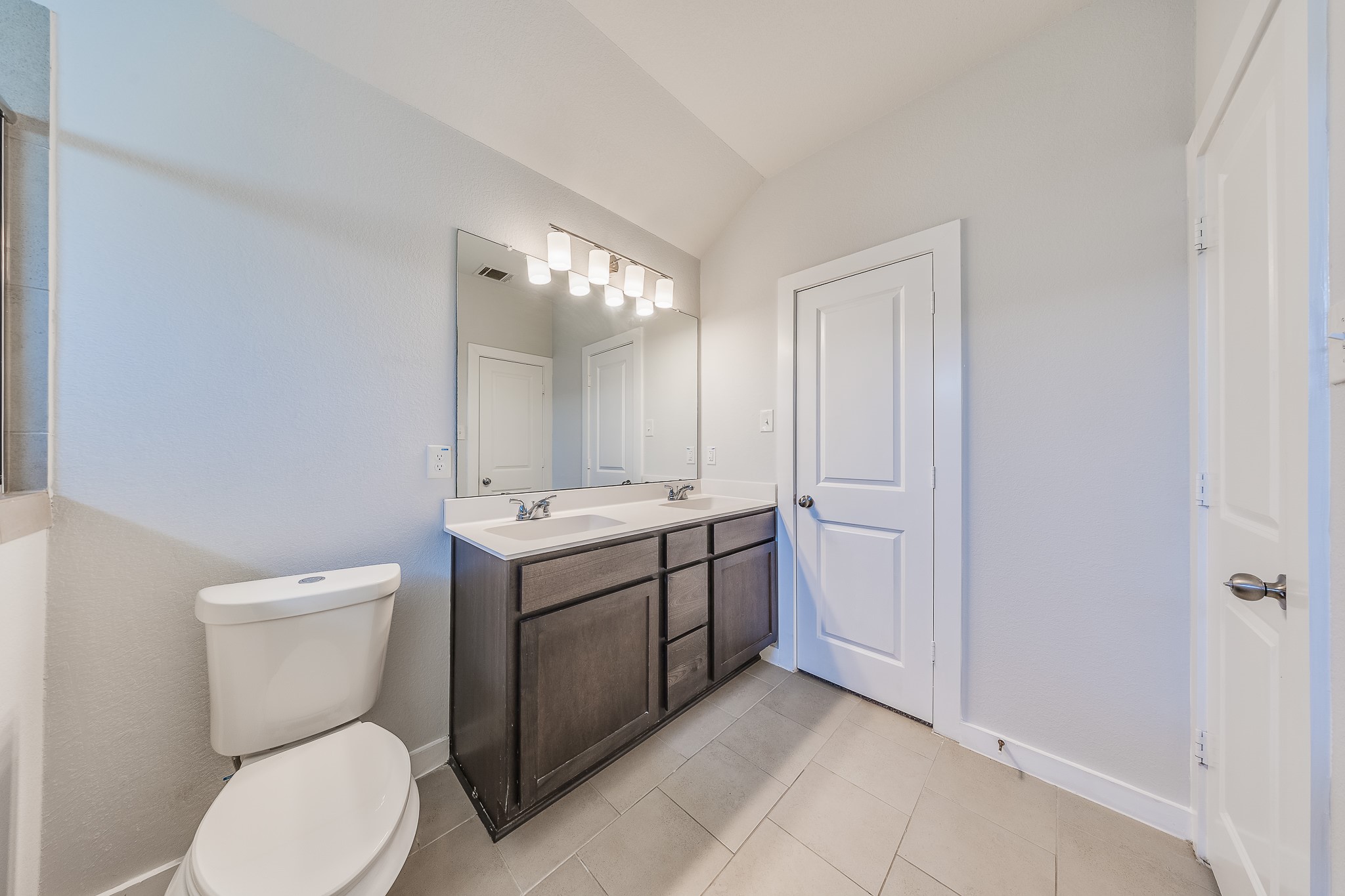 6807 Alamitos Court Rosharon, TX 77583 - Photo 28 of 34 Primary bathroom with dual sinks, offering convenience, stylish design, and ample space for daily routines.