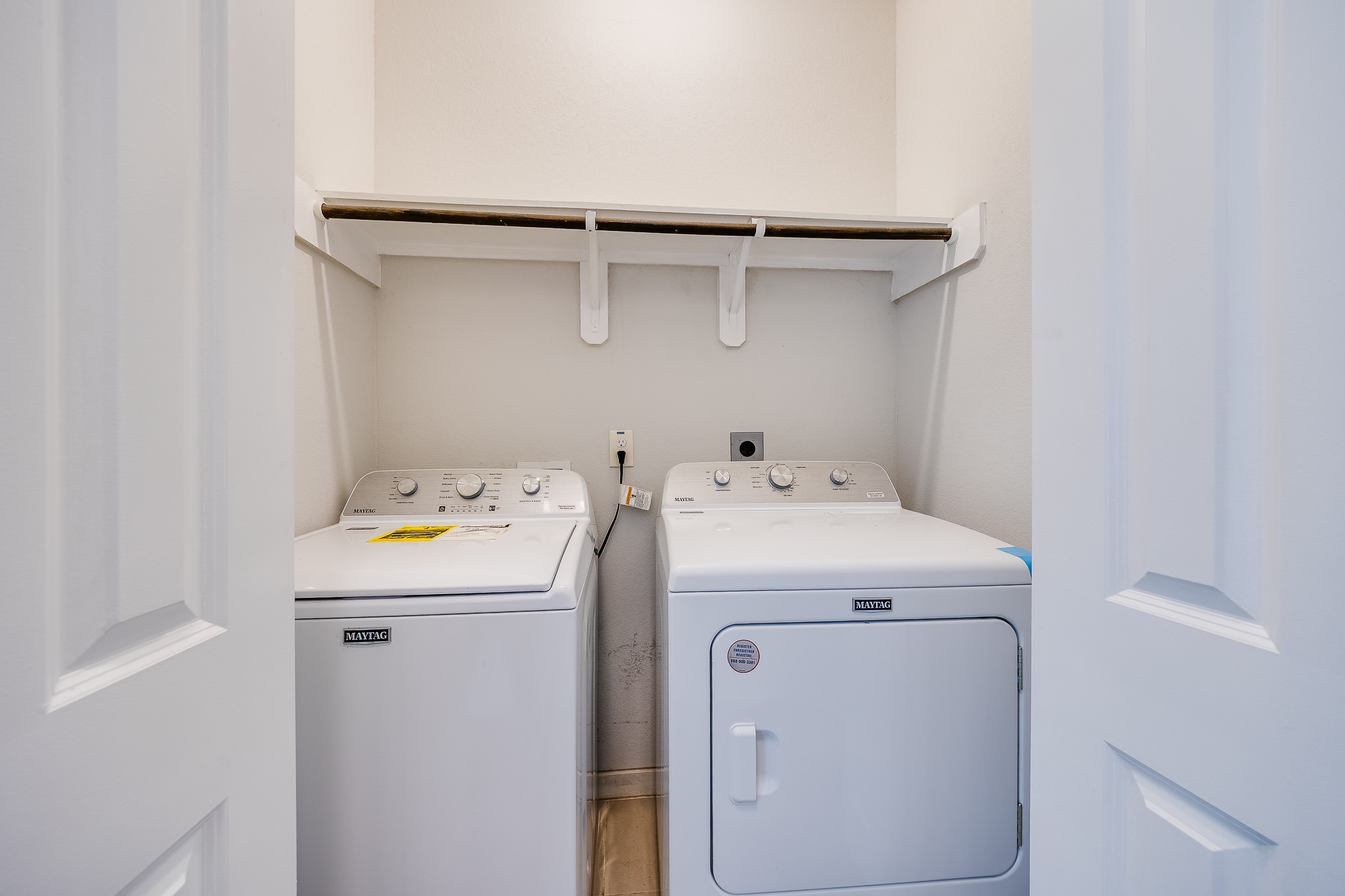 6807 Alamitos Court Rosharon, TX 77583 - Photo 29 of 34 Spacious utility room with ample storage, functional layout, and convenient space for laundry and household tasks.