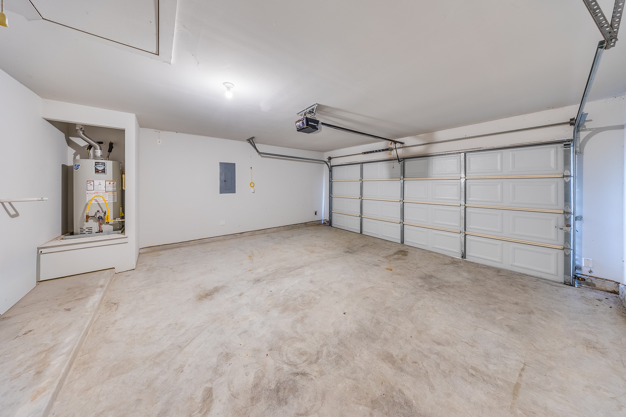 6807 Alamitos Court Rosharon, TX 77583 - Photo 31 of 34 Two-car garage providing secure parking, extra storage space, and convenient access to the home.