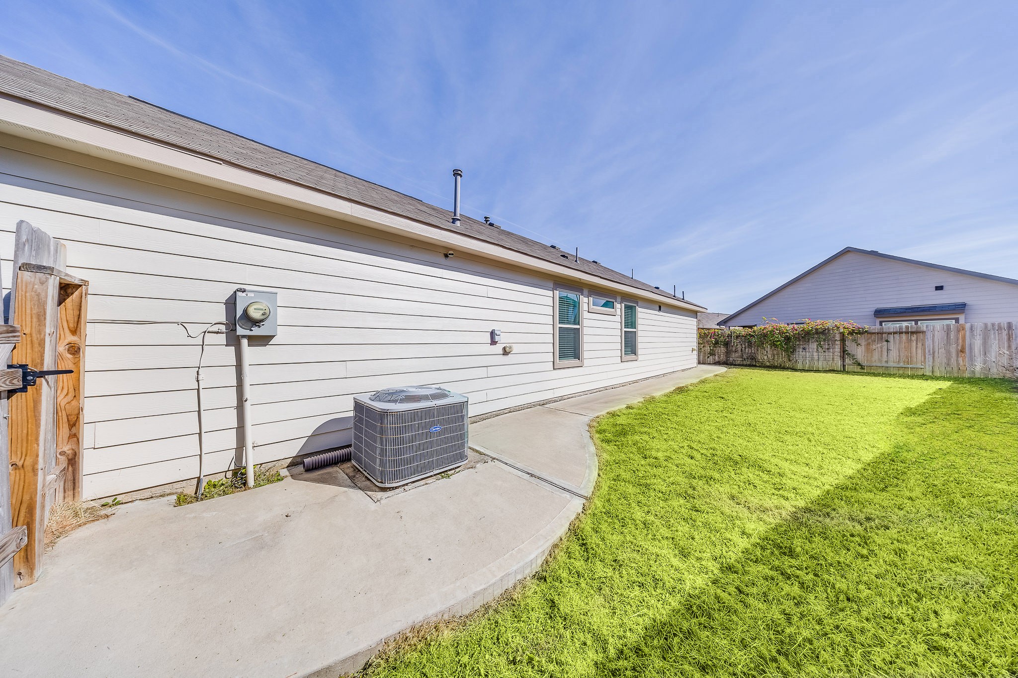 6807 Alamitos Court Rosharon, TX 77583 - Photo 33 of 34 Backyard with a charming patio deck, perfect for outdoor dining, entertaining, or relaxing in a peaceful setting.
