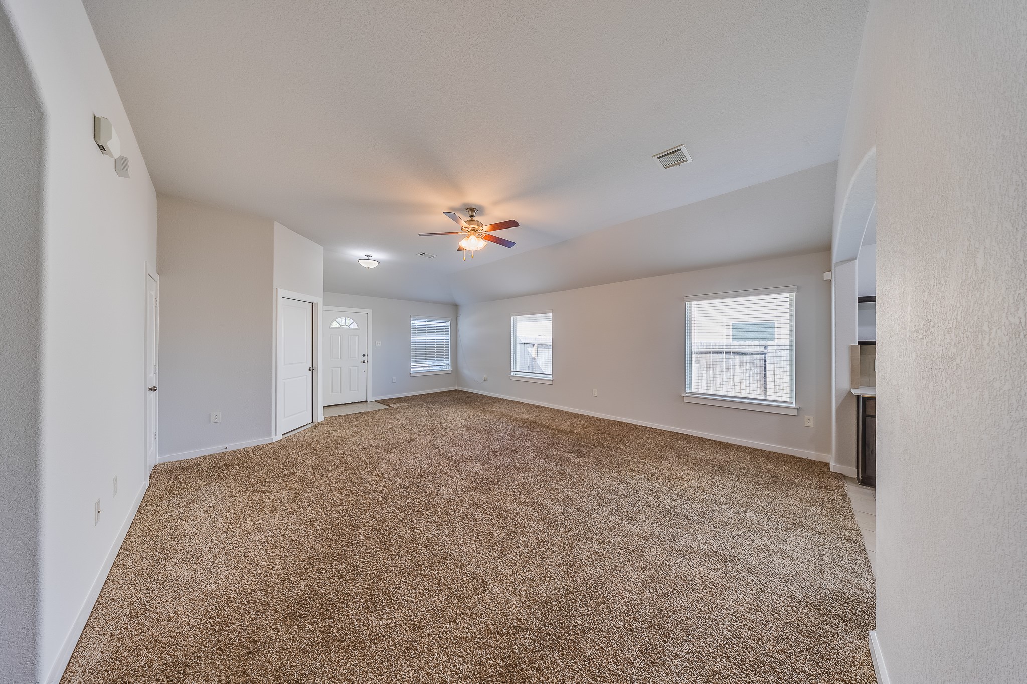 6807 Alamitos Court Rosharon, TX 77583 - Photo 4 of 34 Spacious primary bedroom with abundant natural light, serene atmosphere, and ample space for comfort, relaxation, and privacy.