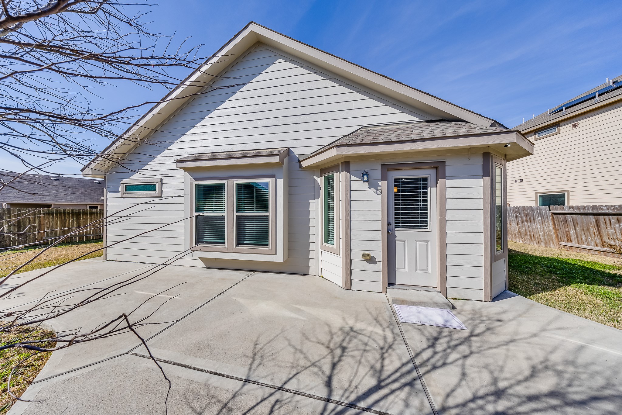 6807 Alamitos Court Rosharon, TX 77583 - Photo 6 of 34 Private backyard featuring a charming patio deck, perfect for outdoor dining, entertaining, or relaxing under open skies.