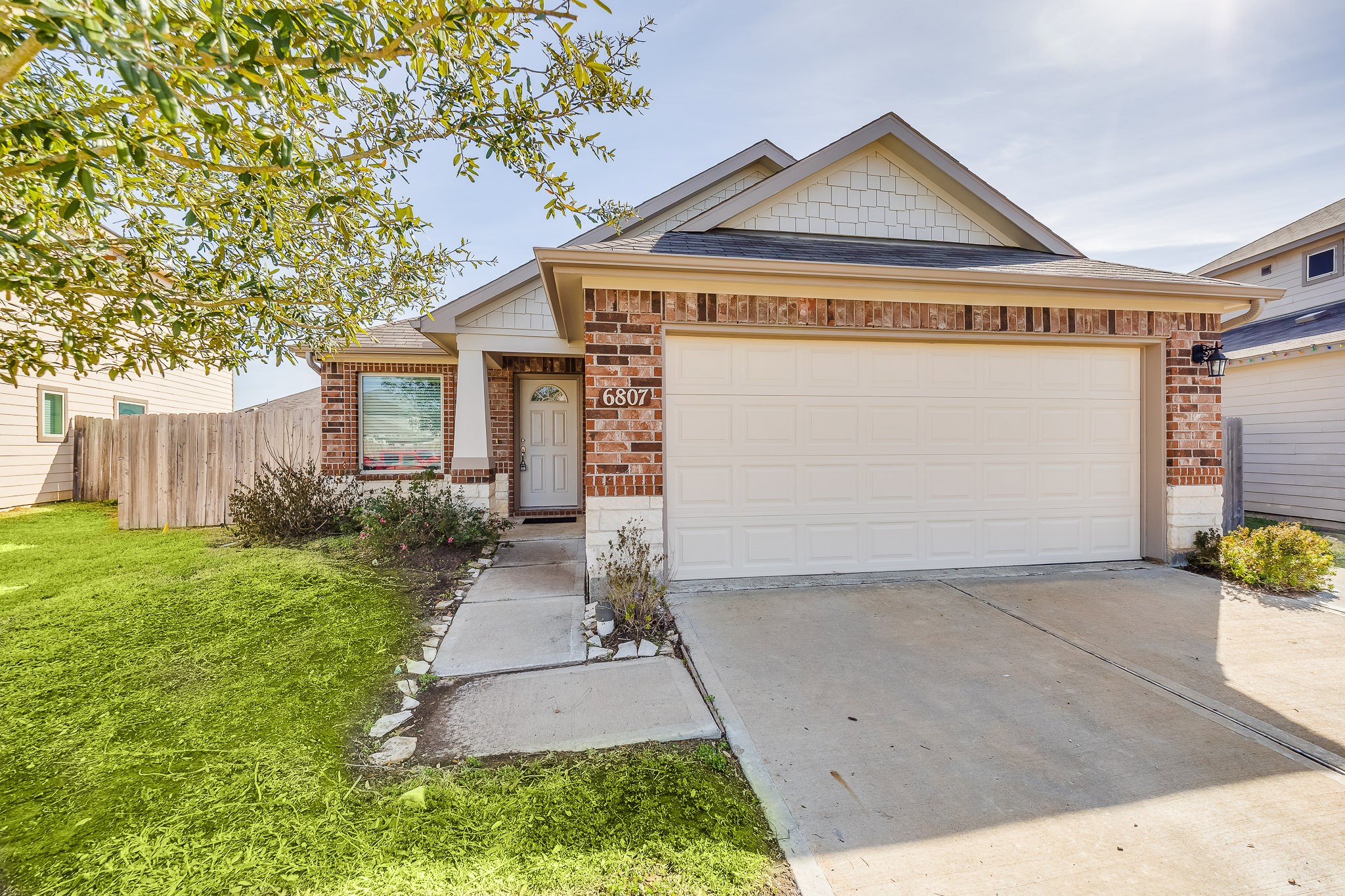 6807 Alamitos Court Rosharon, TX 77583 - Photo 7 of 34 Classic brick façade offering timeless curb appeal, durability, and a welcoming exterior that enhances the home’s overall charm.