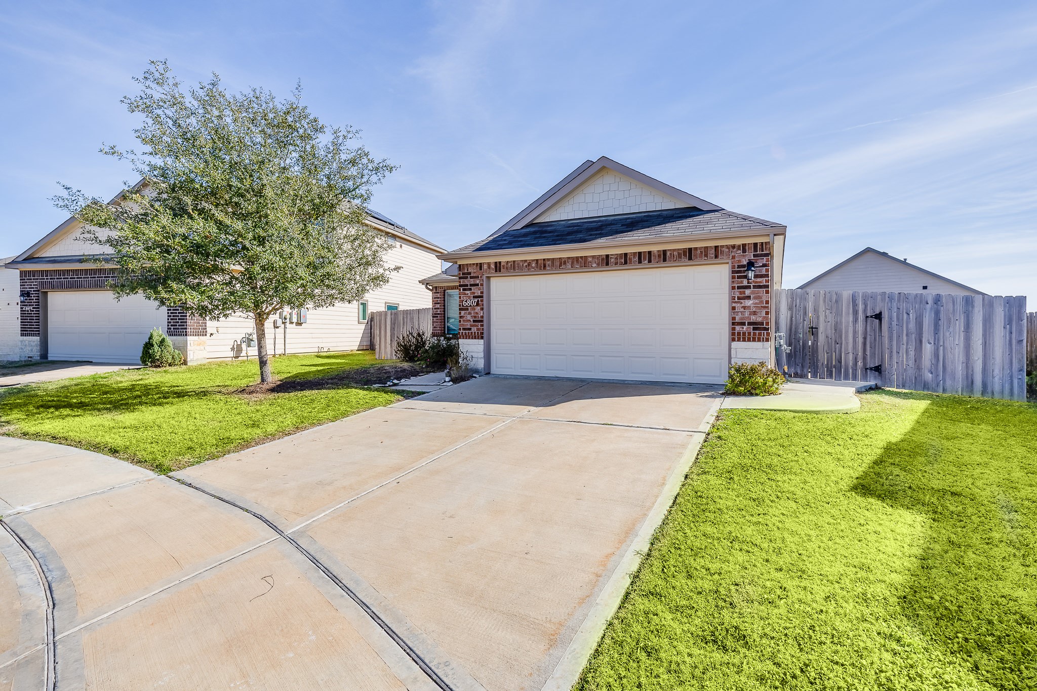 6807 Alamitos Court Rosharon, TX 77583 - Photo 8 of 34 Double-wide driveway providing ample parking space, easy access, and added convenience for multiple vehicles and guests.