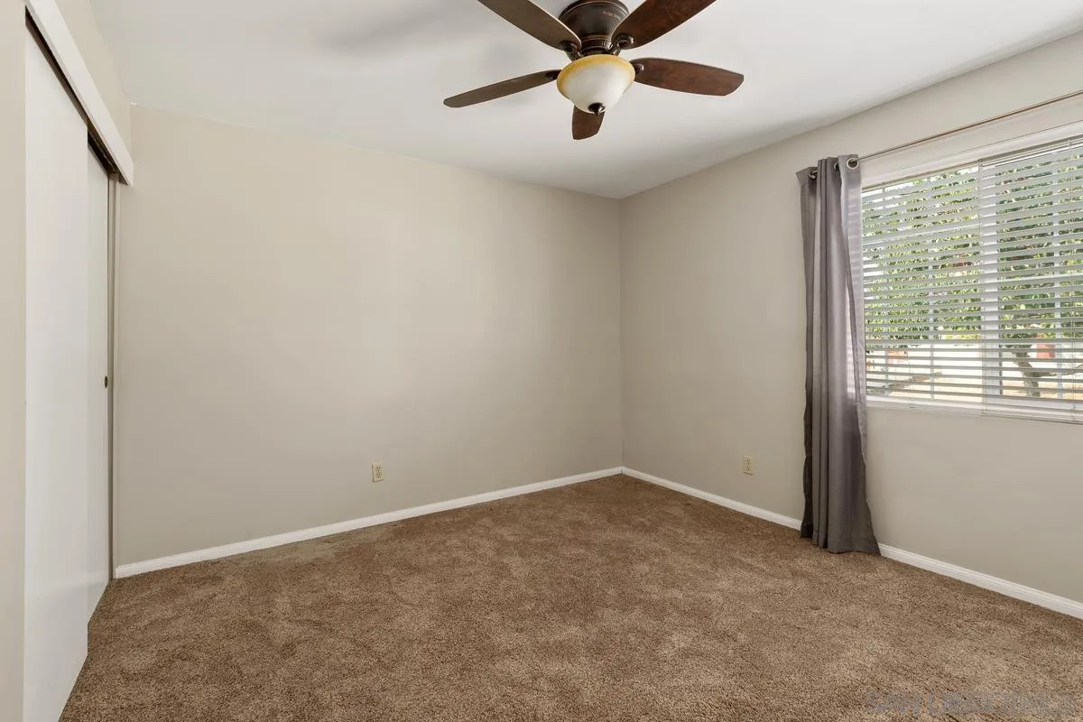 9343 Oakbourne Road Santee, CA 92071 - Photo 11 of 19 an empty room with a window and a fan