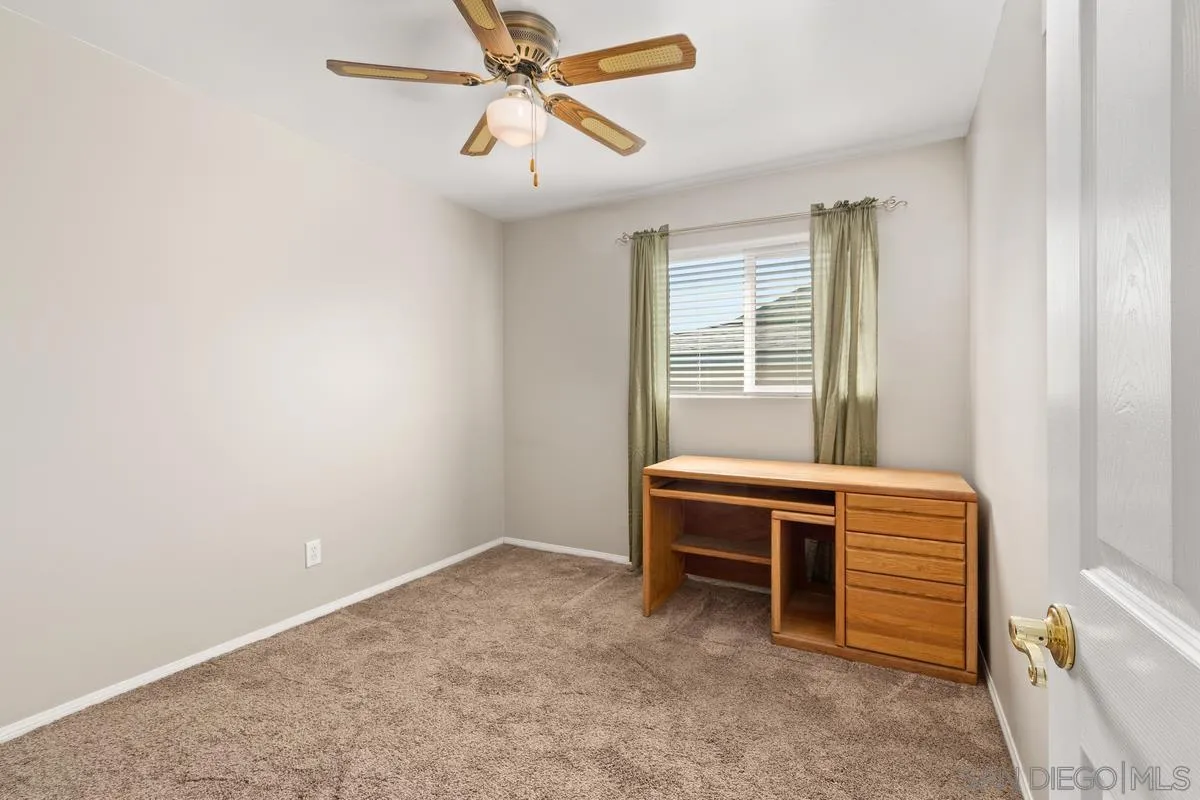 9343 Oakbourne Road Santee, CA 92071 - Photo 13 of 19 a room with a window and a ceiling fan