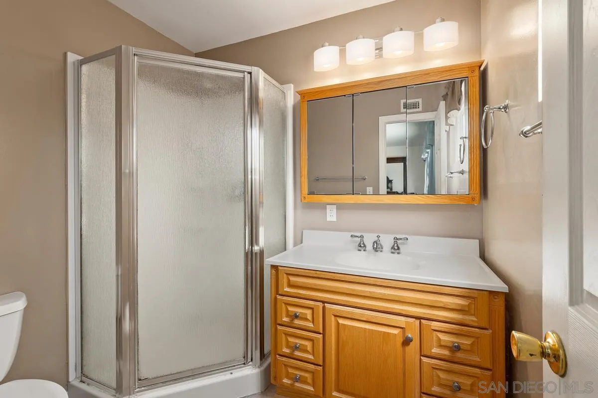 9343 Oakbourne Road Santee, CA 92071 - Photo 16 of 19 a bathroom with a sink and a mirror