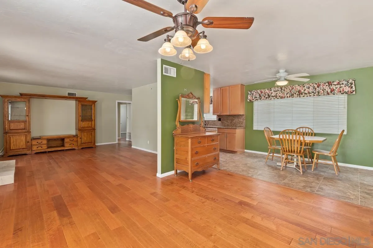 9343 Oakbourne Road Santee, CA 92071 - Photo 5 of 19 a view of a dining room with furniture window and wooden floor