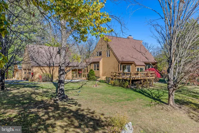 a bathroom with a toilet sink and a mirror
